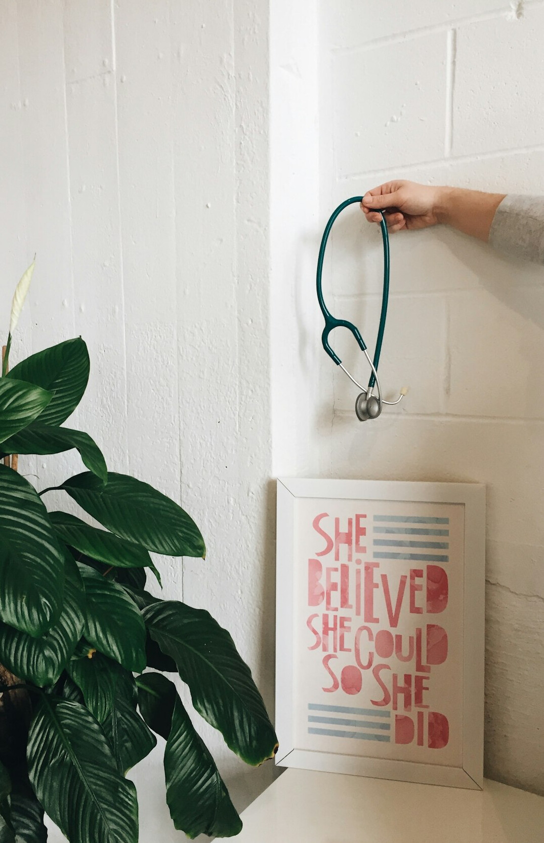 Stethoscope and clipboard on a clean white desk