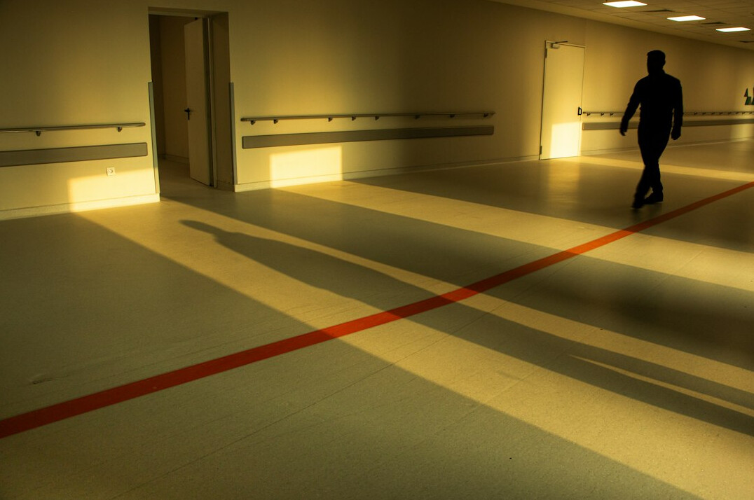 Modern hospital corridor with bright lighting