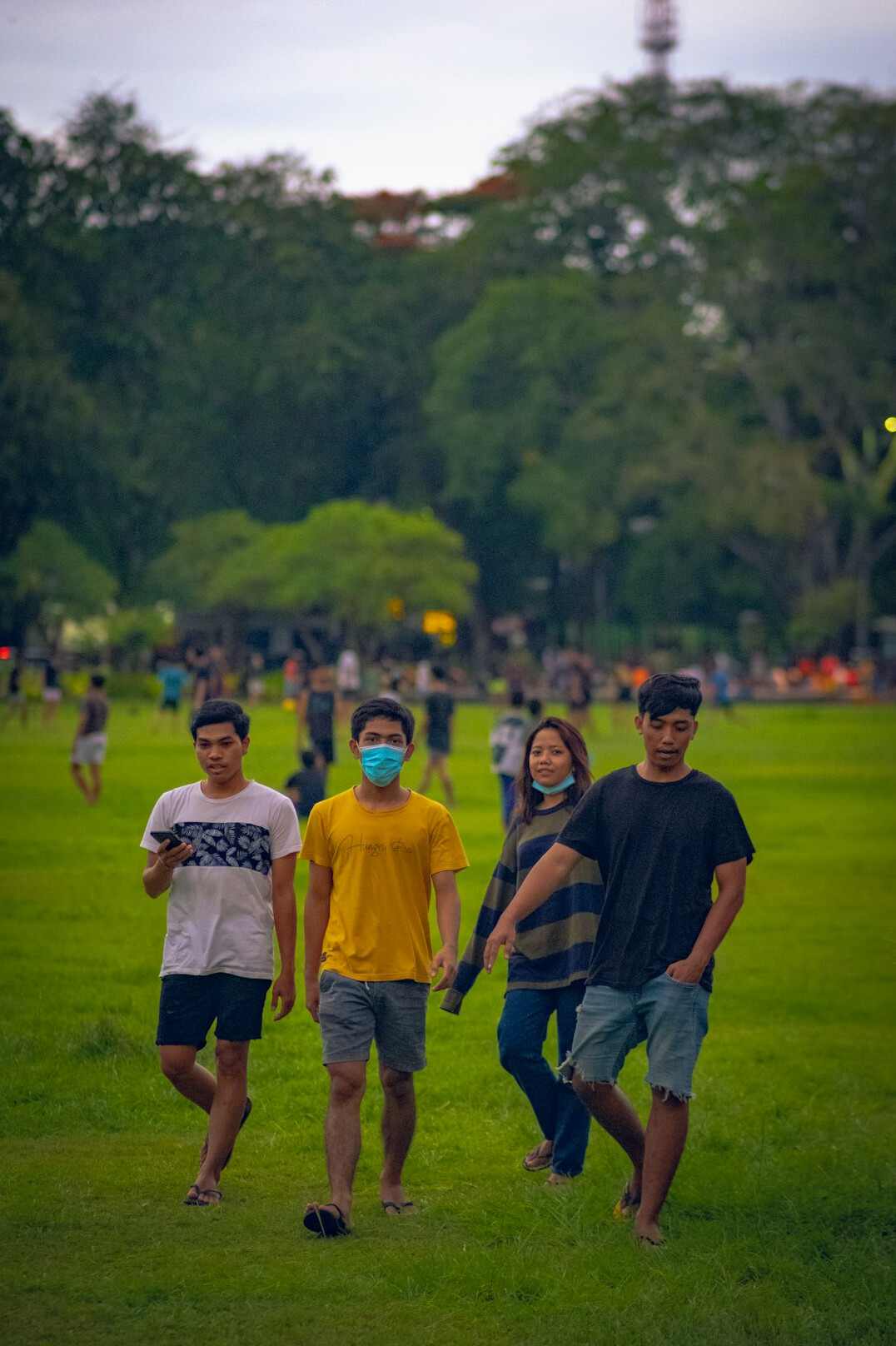 Group of friends jogging together in a park