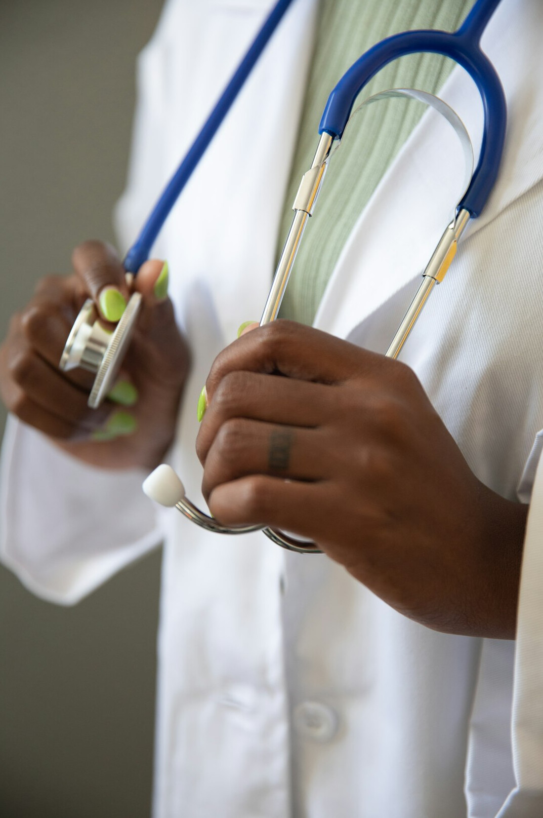 Friendly female doctor with stethoscope in a clinic