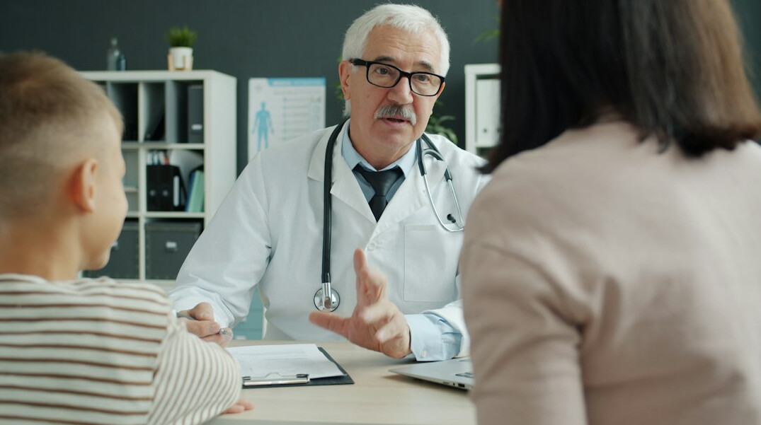 doctor consulting patient about insurance